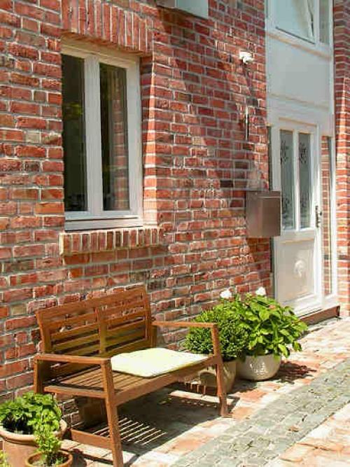 Чем отделать кирпичный дом. Облицовка каменного дома кирпичом