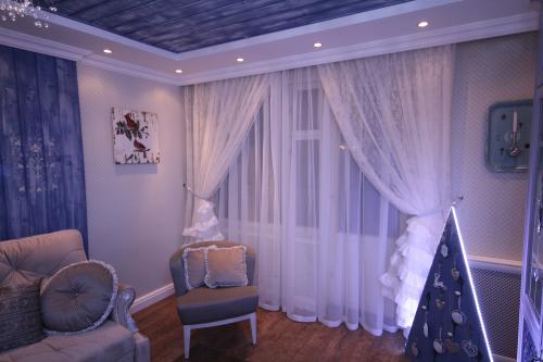 Элегантность и стиль: шторы и тюль для современного зала 23 Элегантность и стиль: шторы и тюль для современного зала 23