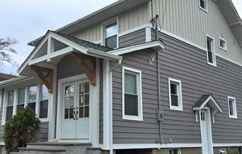 Какие технологии используются для внешней отделки кирпичного дома. Сайдинг