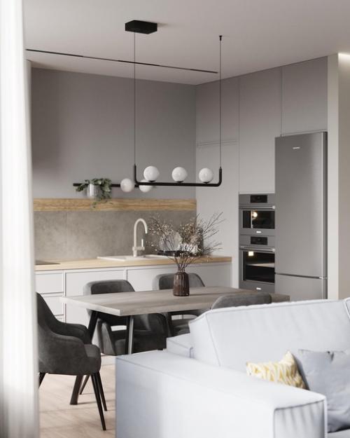 Просторный, обволакивающий и очень сбалансированный интерьер кухни - гостиной для молодой семьи с двумя детьми. 01