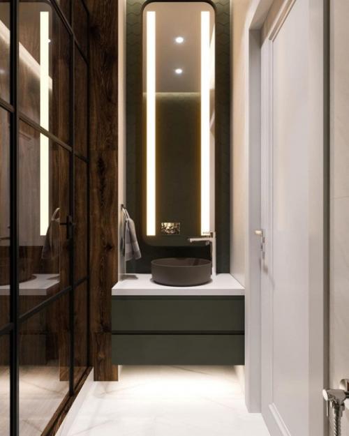 Дизайн санузла.  На стеклянной перегородке чёрные профили, а ещё плитка под дерево здорово тут смотрится. 02