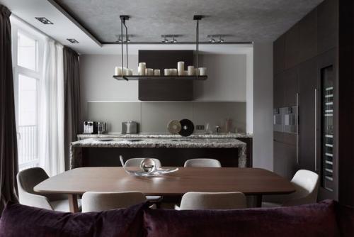 Визуальное разграничение зоны приготовления, питания и отдыха мебелью является частым приемом в интерьерах кухонь, совмещенных с гостиной. 06