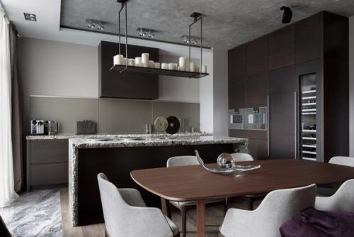 Визуальное разграничение зоны приготовления, питания и отдыха мебелью является частым приемом в интерьерах кухонь, совмещенных с гостиной. 03