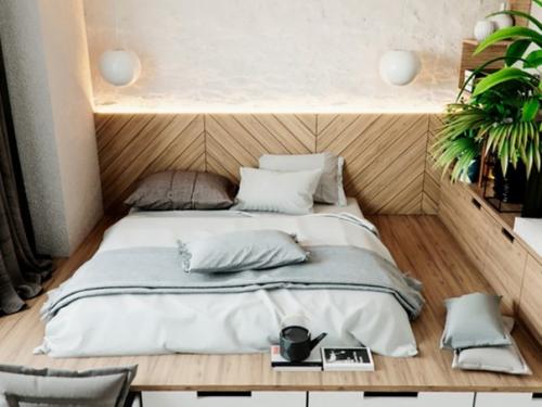 Современный интерьер спальни с кроватью на подиуме с множеством мест хранения. 01