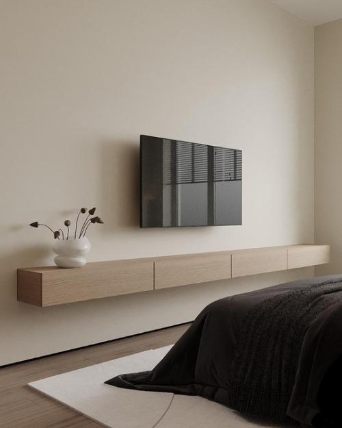 Современная спальня выполнена в стиле минимализма, где каждая деталь продумана для создания атмосферы спокойствия и уюта. 04