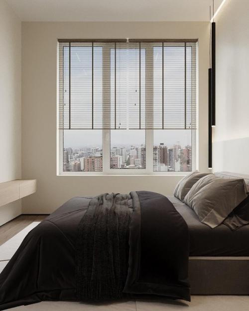 Современная спальня выполнена в стиле минимализма, где каждая деталь продумана для создания атмосферы спокойствия и уюта. 01