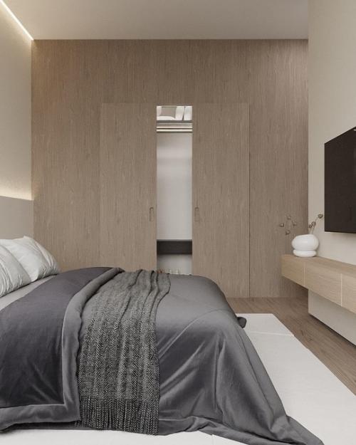 Современная спальня выполнена в стиле минимализма, где каждая деталь продумана для создания атмосферы спокойствия и уюта. 02