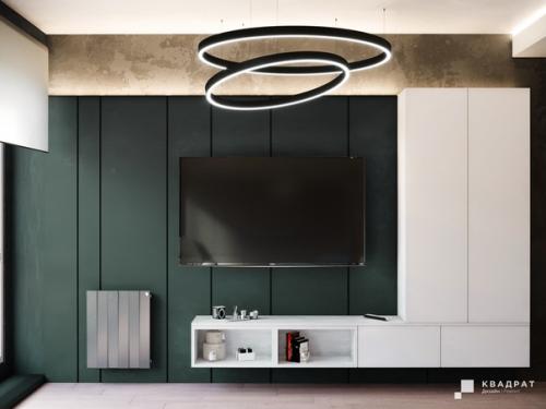 Дизайн гостиной. Мы сделали ставку на яркие акценты, оформив стену в зоне TV в насыщенном зеленом цвете. 03