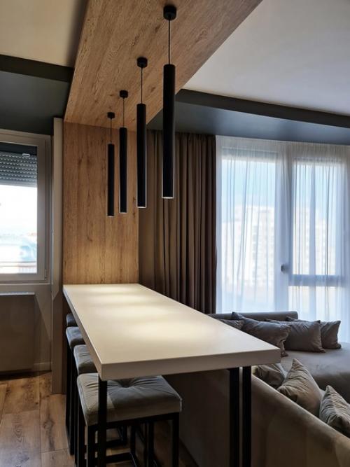 Крутой современный интерьер кухни - гостиной в квартире молодой и креативной семейной пары. 03