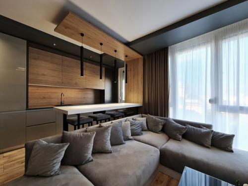 Крутой современный интерьер кухни - гостиной в квартире молодой и креативной семейной пары. 02