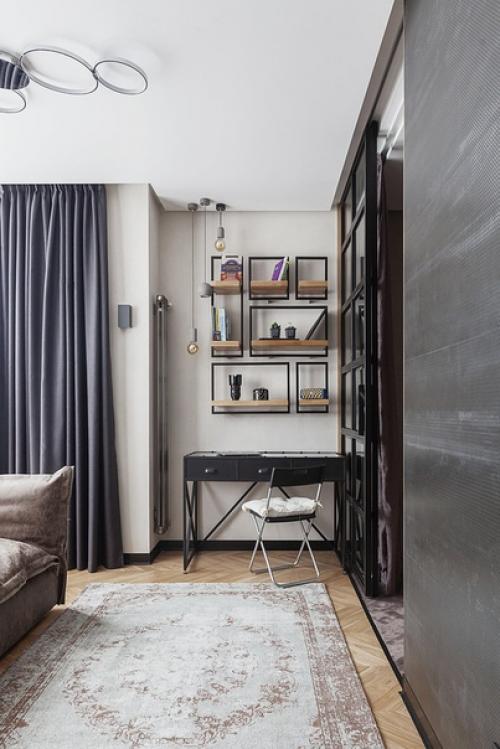 Интерьер с отсылками к стилю лофт и преобладанием черного цвета и бетона. 05