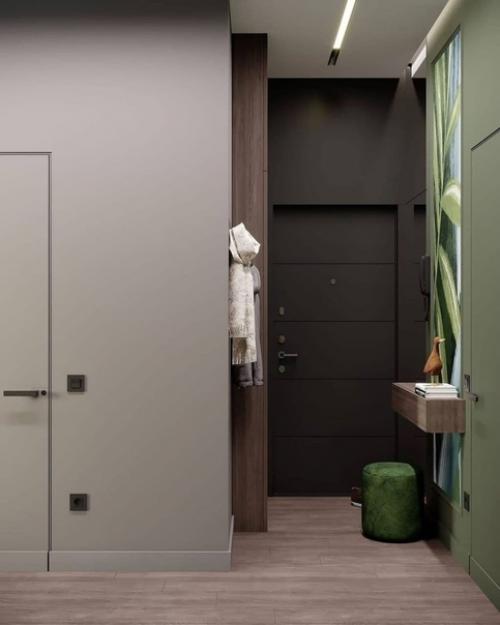 Стильный вариант обустройства прихожей в темной цветовой гамме. 03