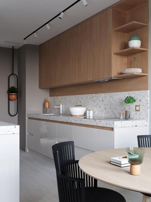 Красивый, современный интерьер кухни - столовой и гостиной в трехкомнатной квартире молодой семейной пары. 01