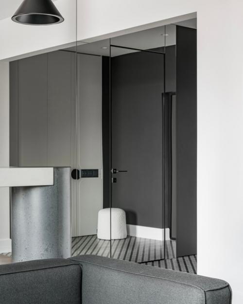 Насыщенные акценты, брутальные фактуры под бетон и минималистичная мягкая мебель. 03