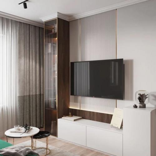 Красивая кухня - гостиная с акцентным зелёным диваном и обустроенной тв - зоной. 04