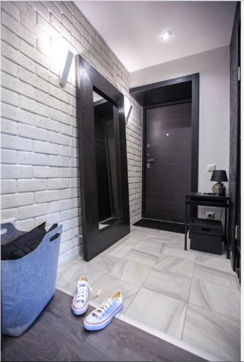 Небольшая квартира - студия с лаконичным интерьером в монохромной гамме. 06