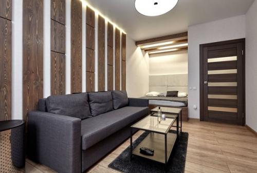 Современный, лаконичный интерьер квартиры - студии, в которой проживает молодой холостяк. 01