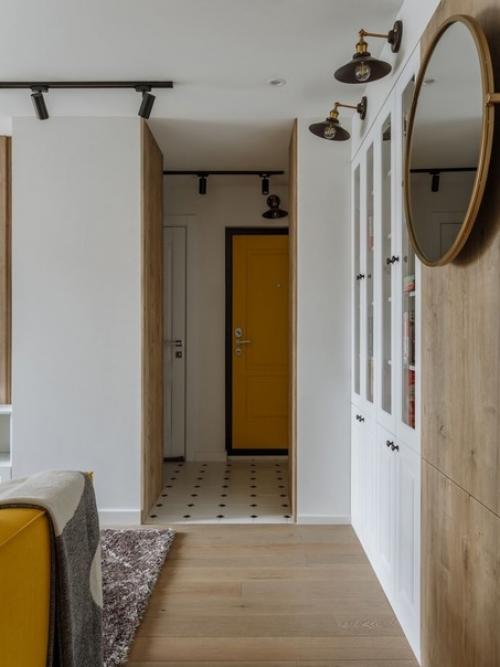 Светлый интерьер кухни и гостиной с яркими желтыми акцентами. 08