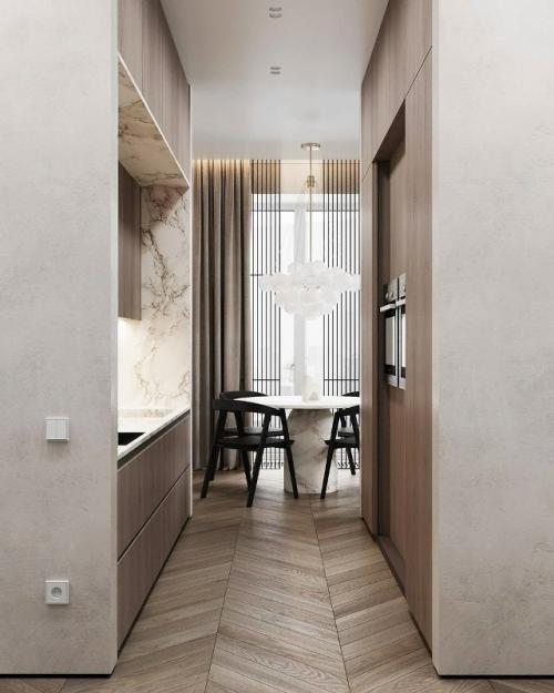 Просторная кухня - гостиная выполнена в светлых тонах. 04