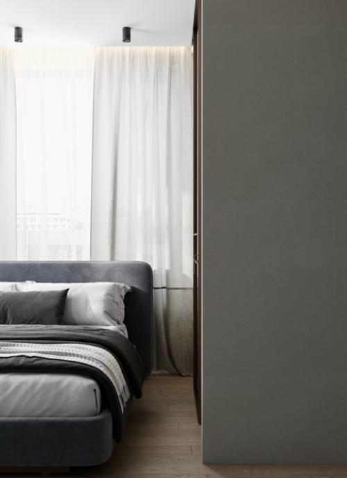 Спальня в квартире в ЖК Союзный оформлена в спокойных нейтральных тонах с акцентом на минимализм и уют. 03