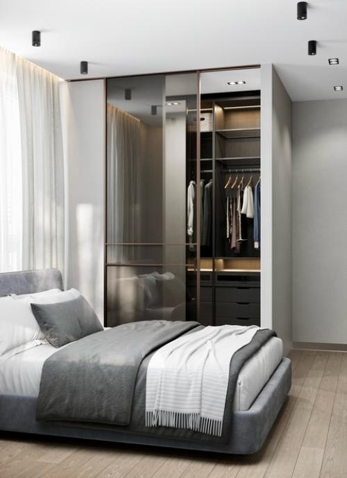 Спальня в квартире в ЖК Союзный оформлена в спокойных нейтральных тонах с акцентом на минимализм и уют. 01