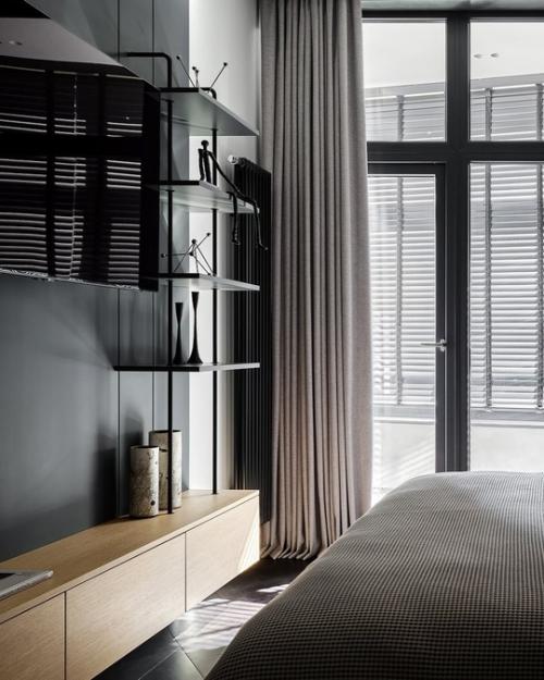 Интерьер квартиры выполнен в тёмной цветовой гамме. 04