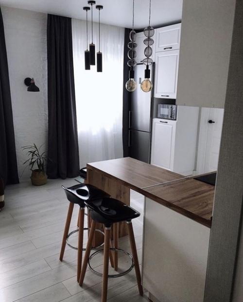 Отличный способ визуально разделить комнату на зону готовки и гостиной с помощью барной стойки. 01