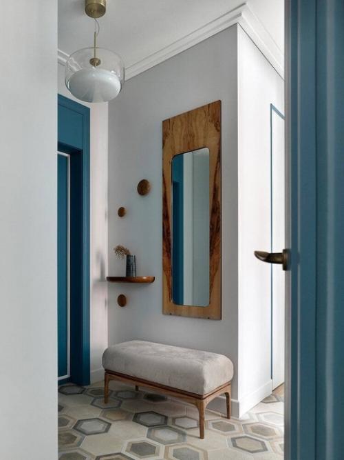 Элегантная квартира с кухней - гостиной и двумя спальнями, интерьер в ахроматических тонах, который смотрится очень воздушным и легким. 06