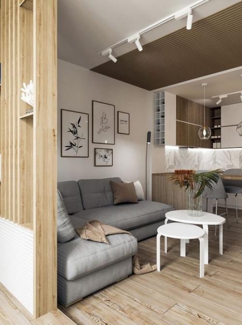 Современный, актуальный, комфортный и легкий интерьер кухни - гостиной в квартире молодой женщины. 01