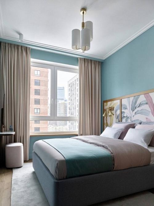 Элегантная квартира с кухней - гостиной и двумя спальнями, интерьер в ахроматических тонах, который смотрится очень воздушным и легким. 05