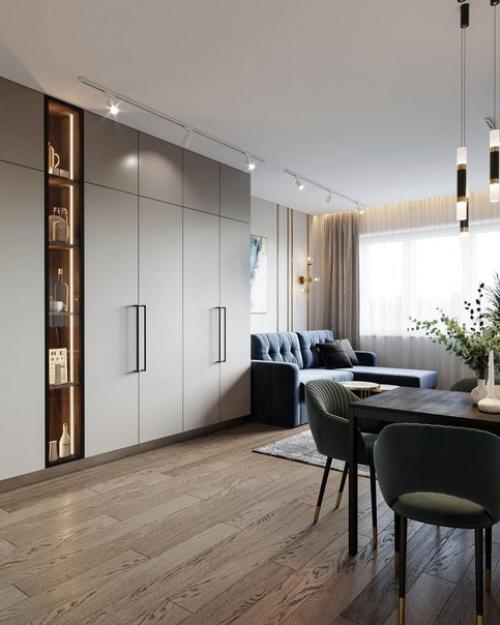 Кухня - гостиная.  Крутое сочетание цветов и мебели, удачным дополнением данного интерьера стал диван в синем цвете. 01