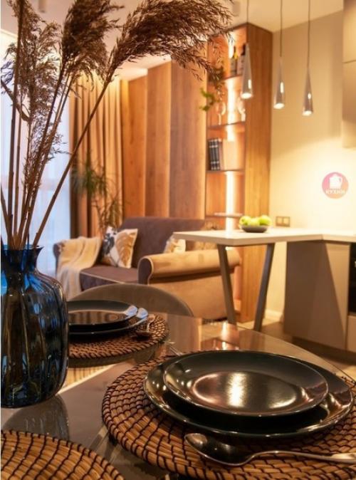 Современный, лаконичный интерьер кухни - гостиной, разработанный дизайнером Еленой Кулешовой. 04