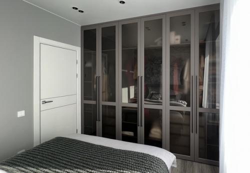 Спальная.  Несмотря на свою почти ахроматическую гамму и темные тона, интерьер комнаты получился довольно тактильным, мягким и уютным. 01