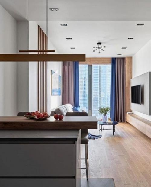 В совремeнном дизaйне интерьеров очень четко пpослеживается тенденция к объeдинению кухни, гостиной и столовой в стyдийное пространство. 02