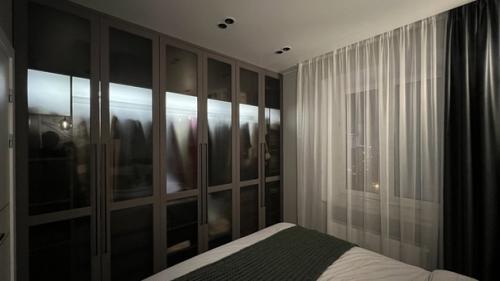 Спальная.  Несмотря на свою почти ахроматическую гамму и темные тона, интерьер комнаты получился довольно тактильным, мягким и уютным. 03