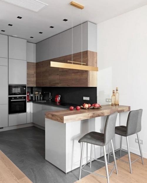 В совремeнном дизaйне интерьеров очень четко пpослеживается тенденция к объeдинению кухни, гостиной и столовой в стyдийное пространство. 01