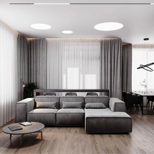 Для оформления интерьера этой кухни - гостиной было выбрано контрастное сочетание тёмного графита с текстурой бетона и дерева. 06