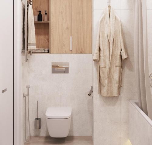 Интерьер санузла. На стенах почти белый керамогранит под бетон Vitra Newcon. 02