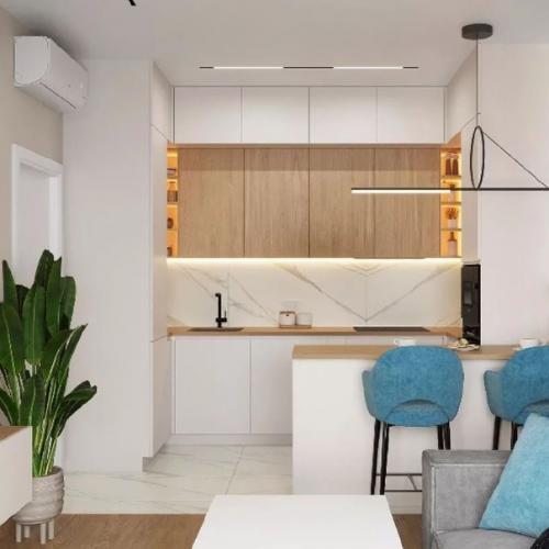 В интерьере этой уютной кухни - гостиной сплелись воедино тепло натурального дерева и прохлада мрамора. 01