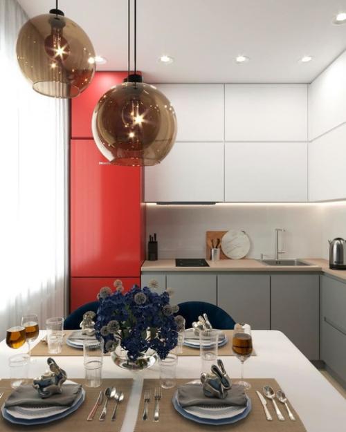 Холодильник на момент проектирования интерьера присутствовал в квартире, и решили сделать его цветовым акцентом для кухни. 01