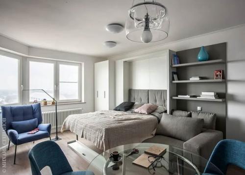 Лаконичный интерьер в стиле минимализм, в котором присутствуют характерные детали: яркие акценты и необычные изделия из металла и стекла. 06