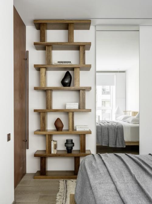 Стеллаж - популярное решение не только для оформления гостиной и рабочего кабинета, но и спальни. 08