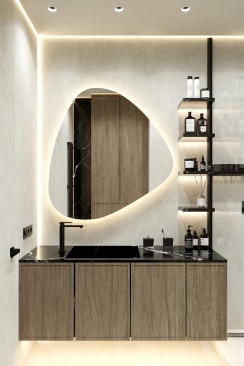 Зеркало с подсветкой имеет оригинальную форму, что делает его стильным и современным элементом интерьера. 02