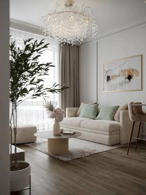 Красивый и элегантный бежевый интерьер кухни - гостиной создаёт тёплую и уютную атмосферу. 03