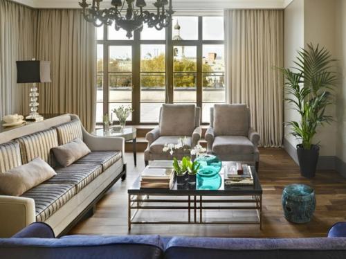 Роскошный интерьер гостиной выполненный в стиле современной классики с элементами арт - деко.